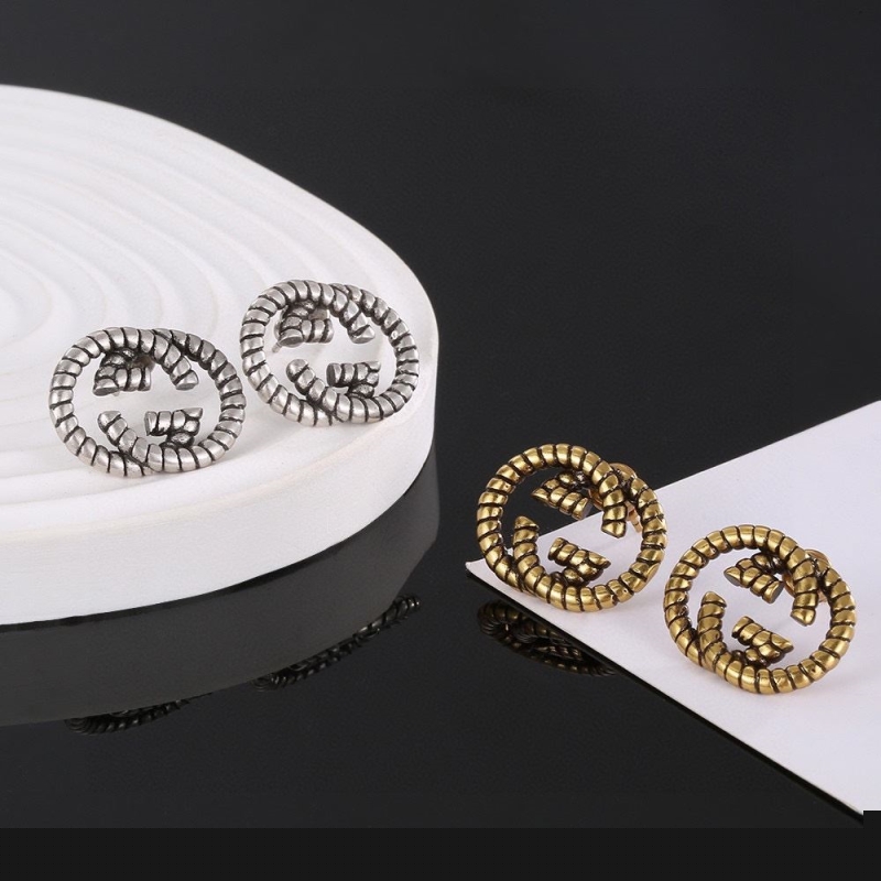 G*u*i earrings